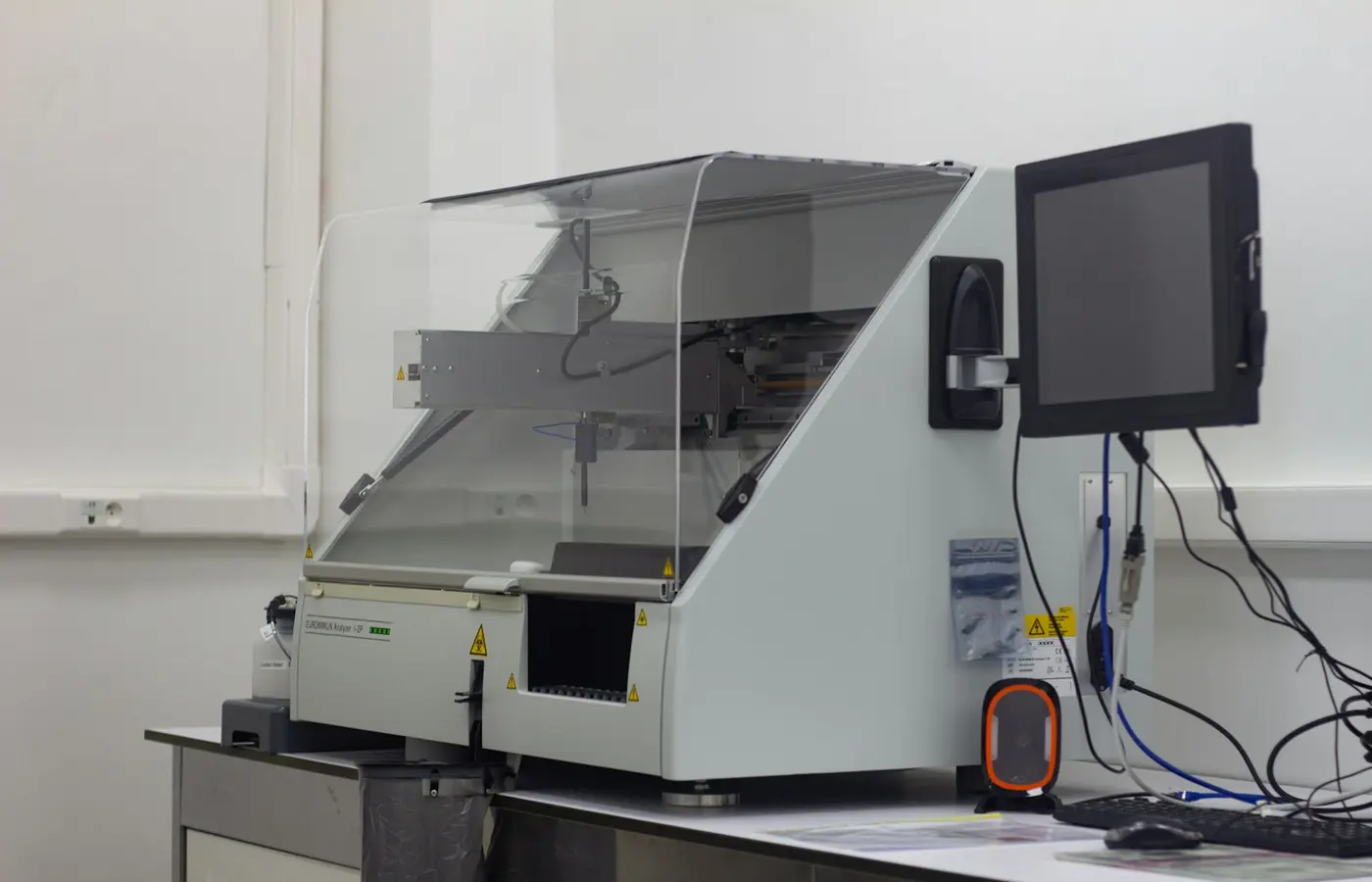 a large white machine with a monitor